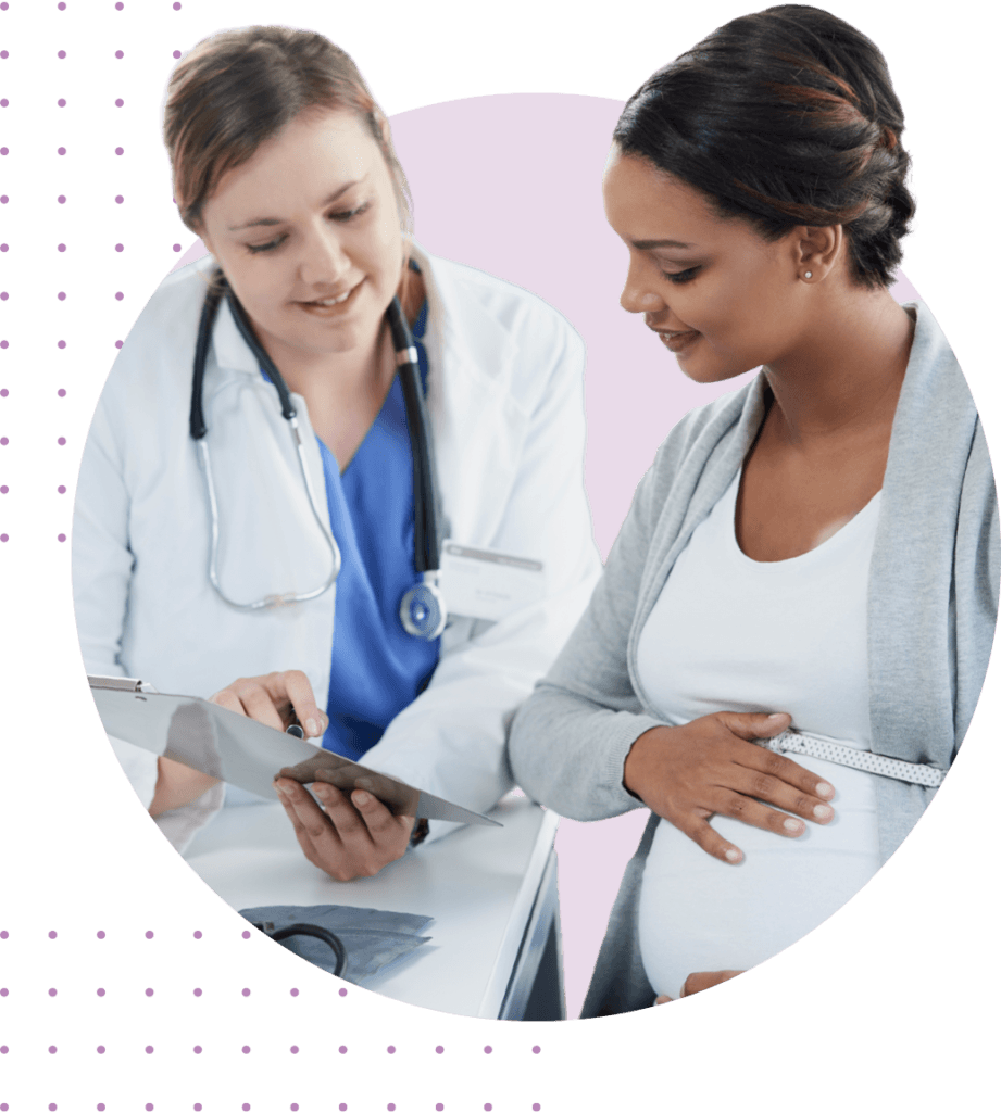 doctor showing pregnant women her clipboard